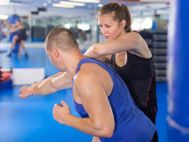 istock Positive female is fighting with trainer 854001056