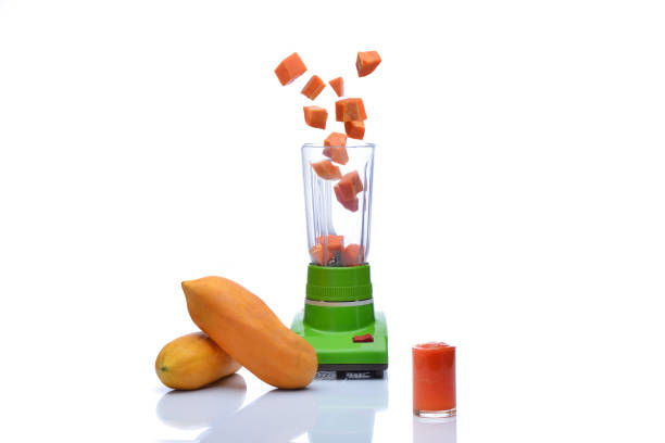 istock Blender is spinning papaya on white background 854011628