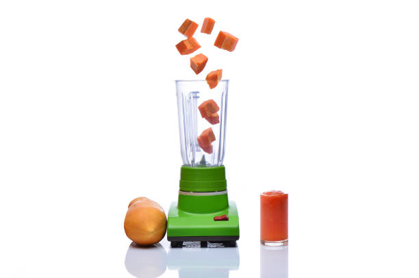 istock Blender is spinning papaya on white background 854011946