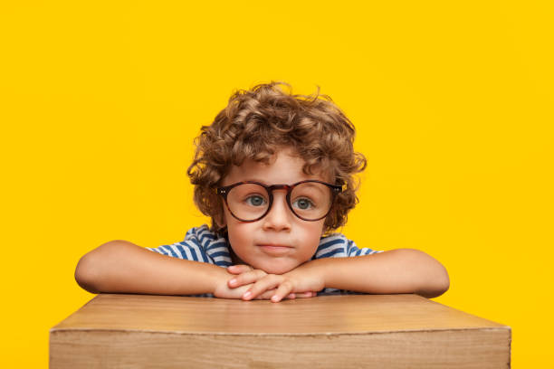 istock Adorable kid in glasses in studio 854012122