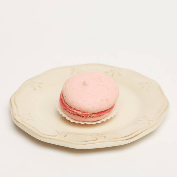 istock Pink macaroon on vintage plate 854012430