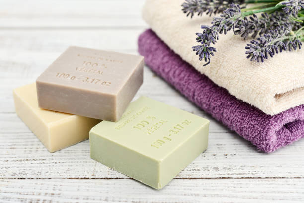 Enriched with Shea Butter 100% vegetal soaps on white wooden background