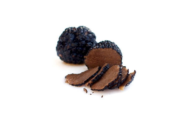 istock Black truffles isolated gourmet food (shallow depth of field) 854017432