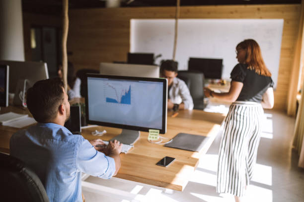 istock Coworkers in an open space office 854017442