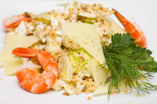 istock Salad with iceberg lettuce and shrimp close-up 854017584