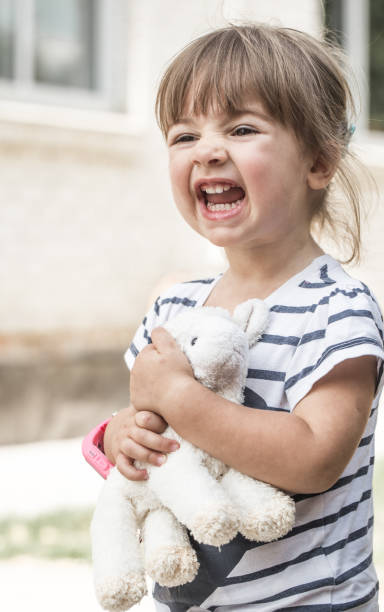 istock little girl with toy lamb 854017794
