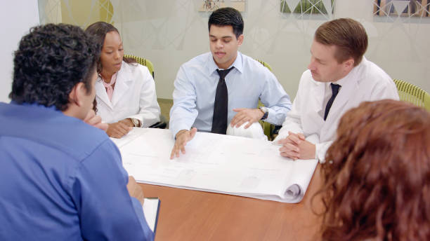 istock Indian Architect Presents to Medical Professionals 854018634