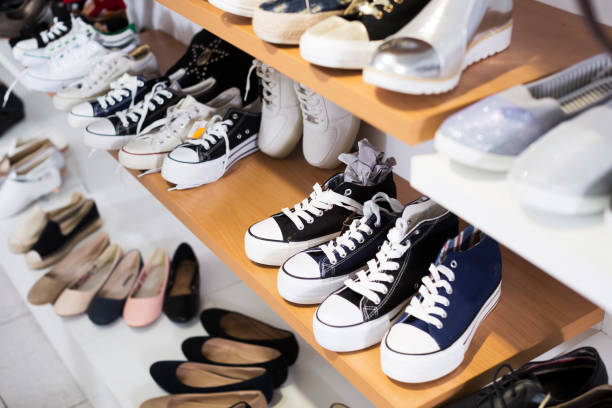 istock Shelves with sneakers in shop 854025272