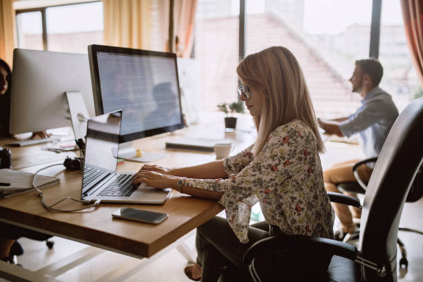 istock Coworkers in an open space office 854026904