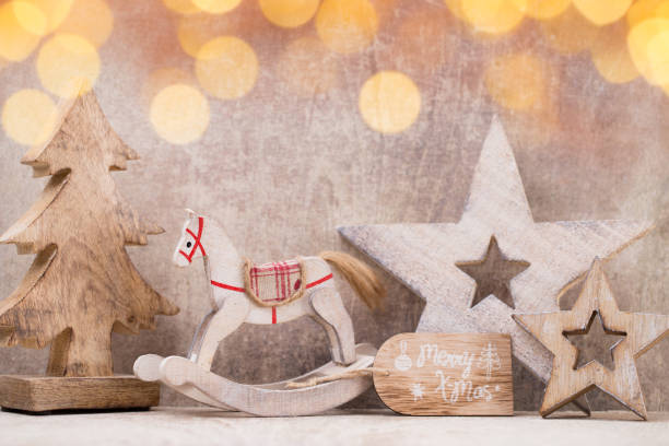 istock Christmas tree decorations on a wooden background. With bokeh ornaments. 854033034