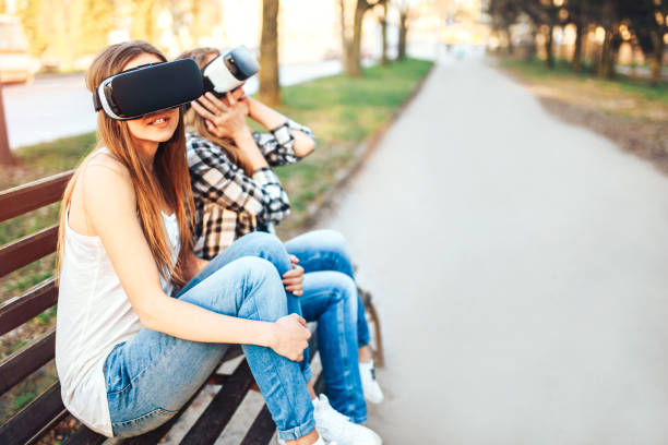istock Two young girls enjoy virtual reality glasses 854033092