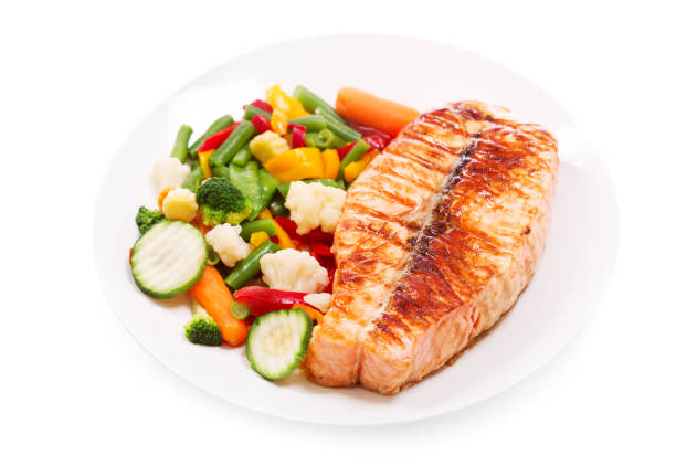 istock plate of grilled salmon steak isolated on white background 854034304