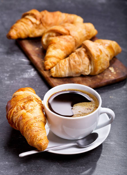 istock cup of coffee and croissants 854036662