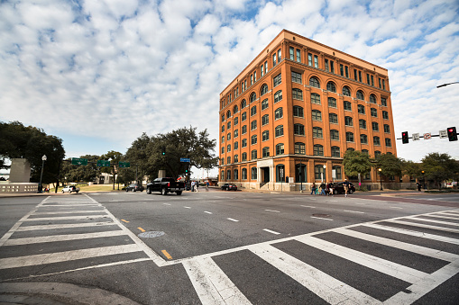 Dallas: The Texas School Book Depository, now known as the Dallas County Administration Building, is a seven-floor building facing Dealey Plaza in Dallas, Texas, United States. The building is most notable as the vantage point of the assassination of John F. Kennedy on November 22, 1963. An employee, Lee Harvey Oswald, shot and killed Kennedy from a sixth floor window on the building's southeastern corner. The structure is a Recorded Texas Historic Landmark.