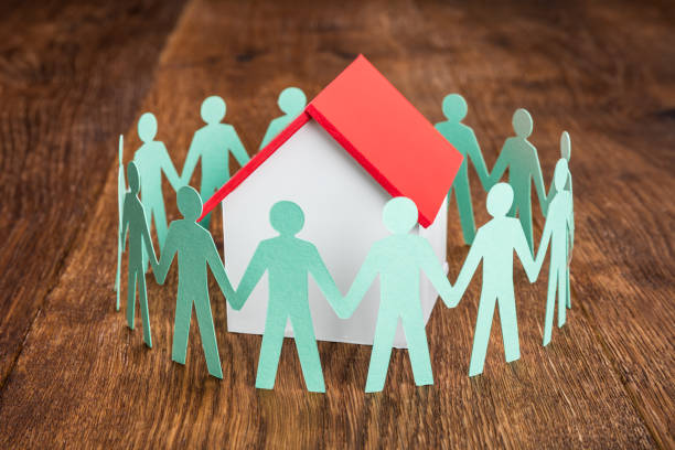 istock House Model With Papercut On Wooden Desk 854043636