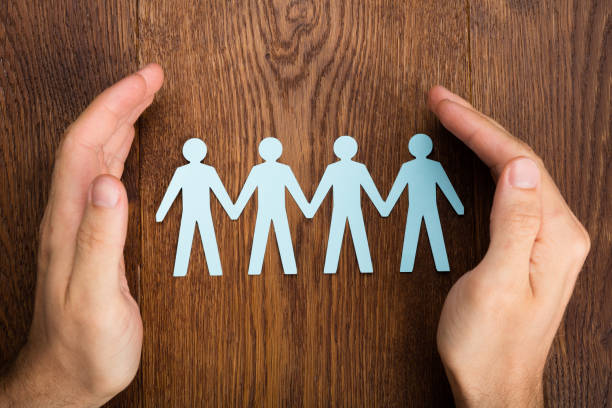 istock Person Hand Protecting Human Figure Cutout 854044430