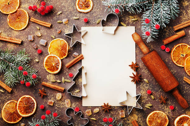 istock Food background for baking gingerbread cookies with cutters, rolling pin and spices on table top view. Vintage paper sheet for christmas recipe. 854047878