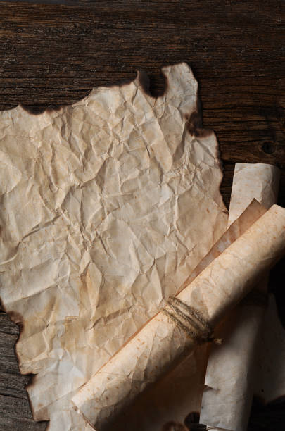istock Old paper with the burned edges 854056116