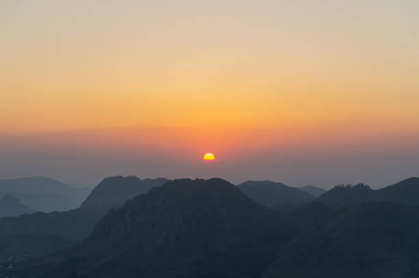 istock Silhouettes of mountains at sunset 854059696