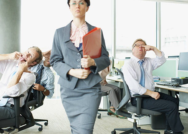 Businesspeople making face at boss in office  sneering stock pictures, royalty-free photos & images