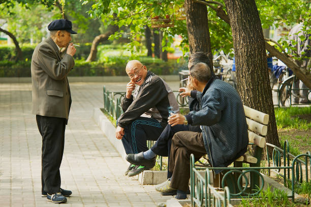 Beijing, China - April 30, 2009: Unidentified senior men talk at Jingshan Park in Beijing, China.