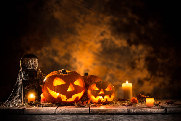 Halloween pumpkins on wooden planks Halloween pumpkins on wooden planks with spooky background. halloween pumpkin scary stock pictures, royalty-free photos & images