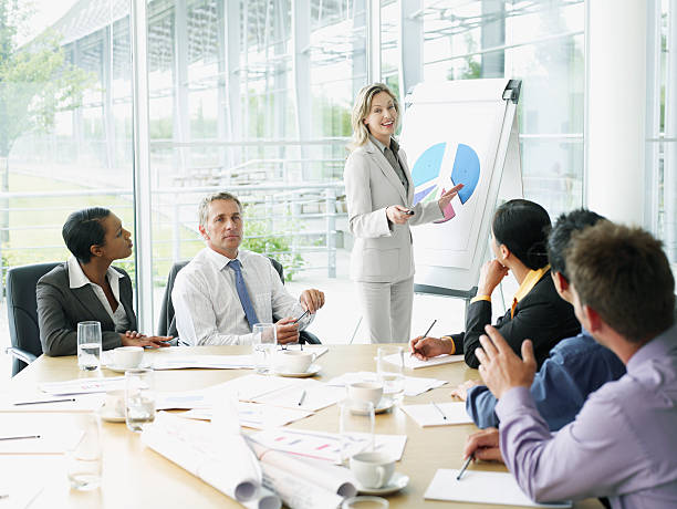 Businesspeople having meeting in conference room  flipchart stock pictures, royalty-free photos & images