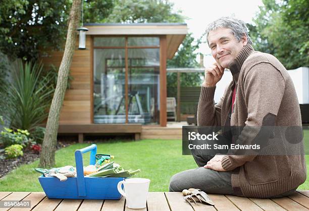 Man Gardening In Backyard Stock Photo - Download Image Now - Yard - Grounds, Building Exterior, Men