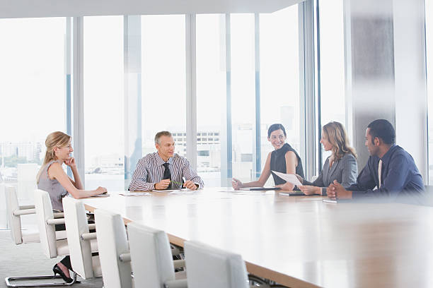 Businesspeople having meeting in conference room  conference table stock pictures, royalty-free photos & images