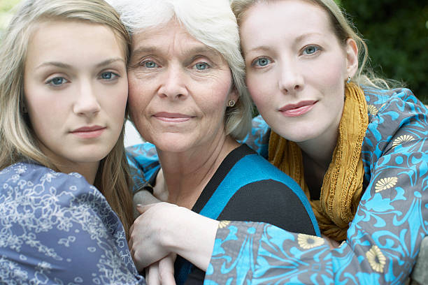 Grandmother, mother and daughter hugging  cheek to cheek photos stock pictures, royalty-free photos & images