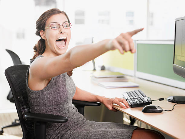 Businesswoman pointing and shouting  teasing photos stock pictures, royalty-free photos & images