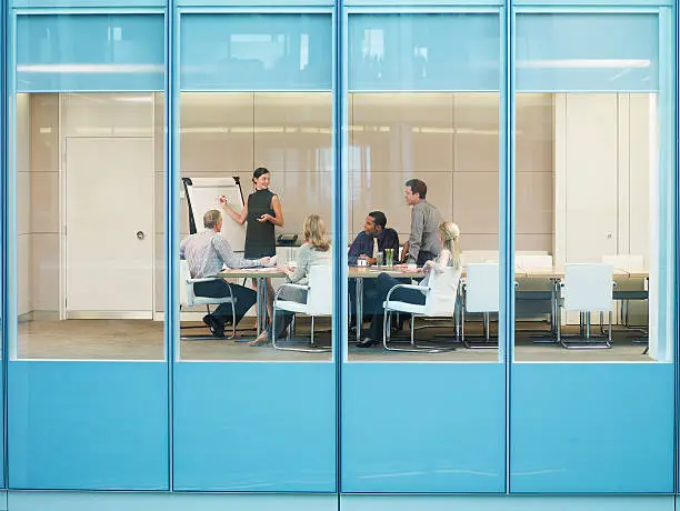 Photo of Businesspeople having meeting in conference room