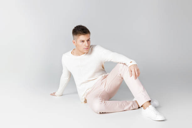 istock handsome young man in a white sweater 854069038