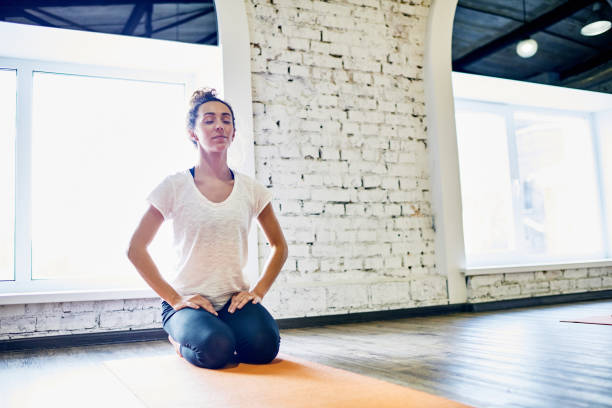 istock Relaxed woman preparing for yoga 854073744