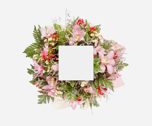 istock Creative layout made of flowers and leaves with paper card note. Flat lay 854074104