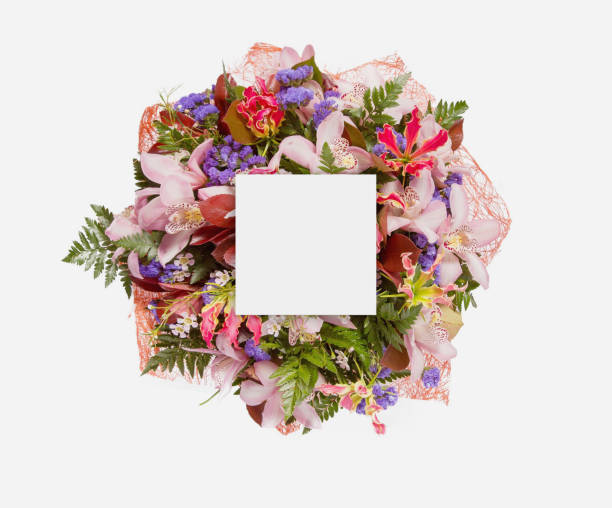 istock Creative layout made of flowers and leaves with paper card note. Flat lay 854074176