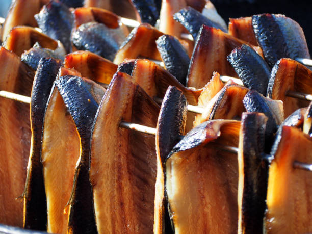 herring smoking herring smoking in the Netherllands kipper stock pictures, royalty-free photos & images