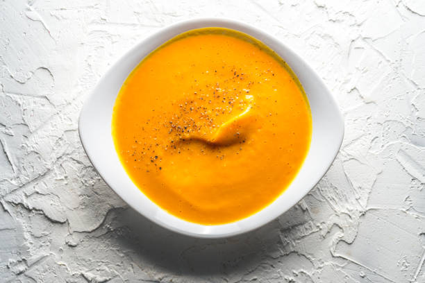 istock Homemade pumpkin soup in a white plate 854078394