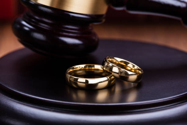 istock Wedding Rings Are Placed On Gavel 854079674