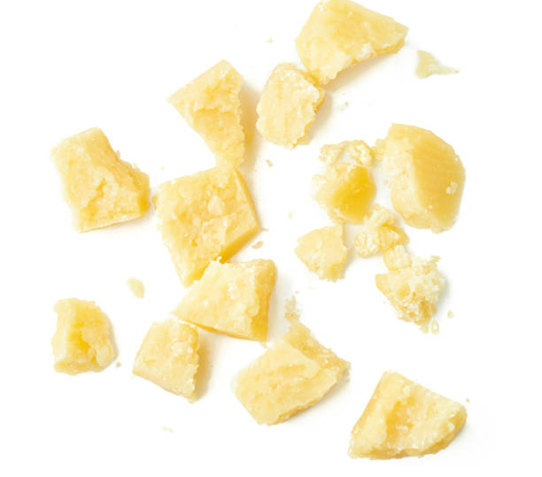 istock Parmesan cheese pieces on white background. Italian cheese slices. Top view. 854079676