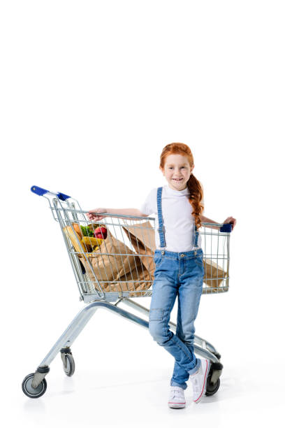 istock redhead child with shopping trolley 854083066