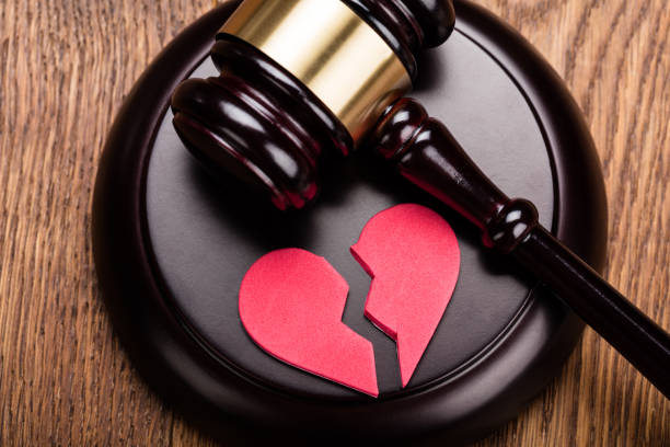 istock Red Broken Heart On Wooden Gavel 854083858