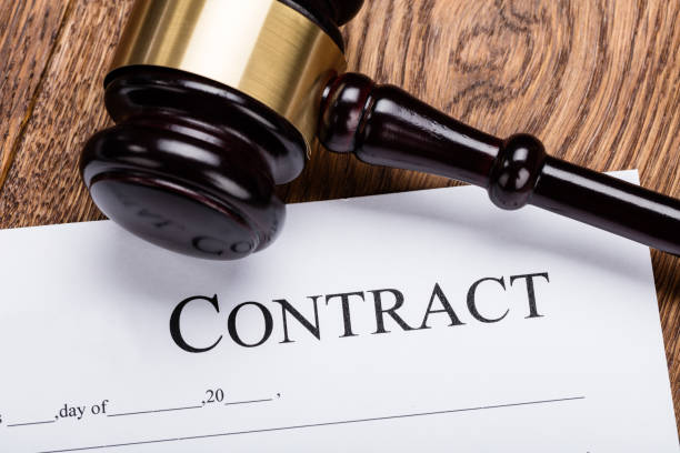 istock Wooden Gavel On Contract Paper 854089462