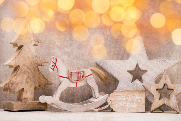 istock Christmas tree decorations on a wooden background. With bokeh ornaments. 854090014