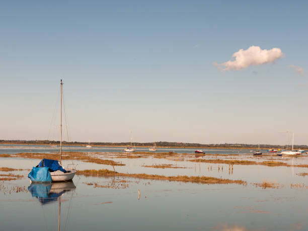 istock beautiful peaceful harbour scene estuary maldon boat mast reflections 854092336
