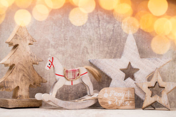 istock Christmas tree decorations on a wooden background. With bokeh ornaments. 854093776