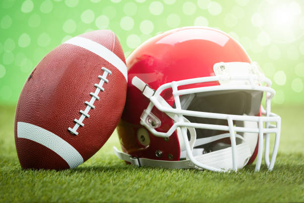 istock Rugby Helmet With Ball On Field 854099040