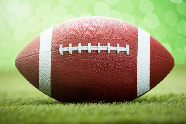 istock Rugby Ball On Grassy Field 854099246