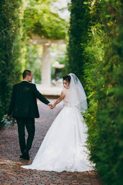 istock Beautiful wedding couple on a walk outdoor 854103448