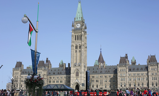 Ottawa, Canada - August 25, 2017: Changing of the Guard ceremony, Parliament Hill, Ottawa. The Parliament Buildings include the Centre Block with the Peace Tower. National Historic Site of Canada. Summer day in Canada's National Capital Region.